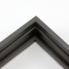 This tall, deep stair step floating canvas frame in matte black features a shallow recessed stair below the outer face and a natural wood grain texture. The canvas will hover neatly, resting on the lowest, flat edge.  

Give an authentic, fine art display to your favourite canvas Giclée print or acrylic painting. This canvas floating frame is ideal for medium, large or extra large canvases on thick (1.5 " deep) stretcher bars.

*Note: These solid wood, custom canvas floaters are for stretched canvas prints and paintings, and raised wood panels.